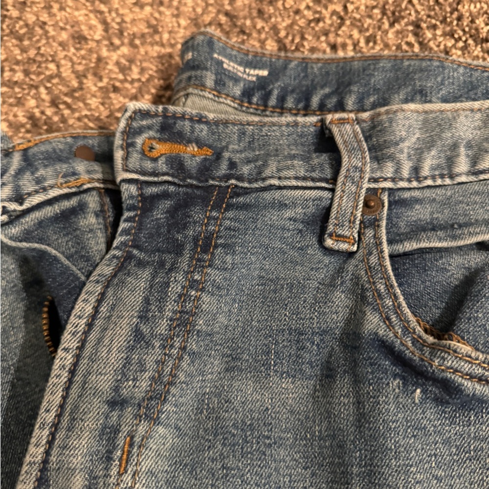 Men’s distressed athletic taper blue jean